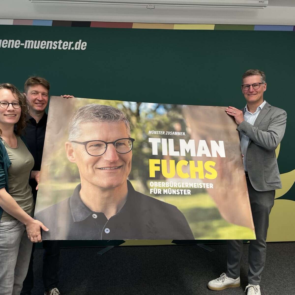 Sonja Völker, Jörg Rostek und Tilman Fuchs mit einem Plakat
